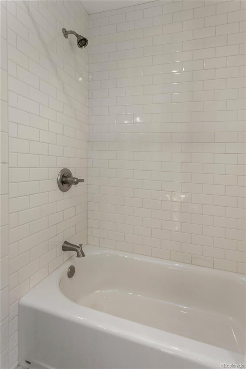 1208 E Street Salida, CO 81201 - Photo 29 of 50 a bathroom with a bathtub