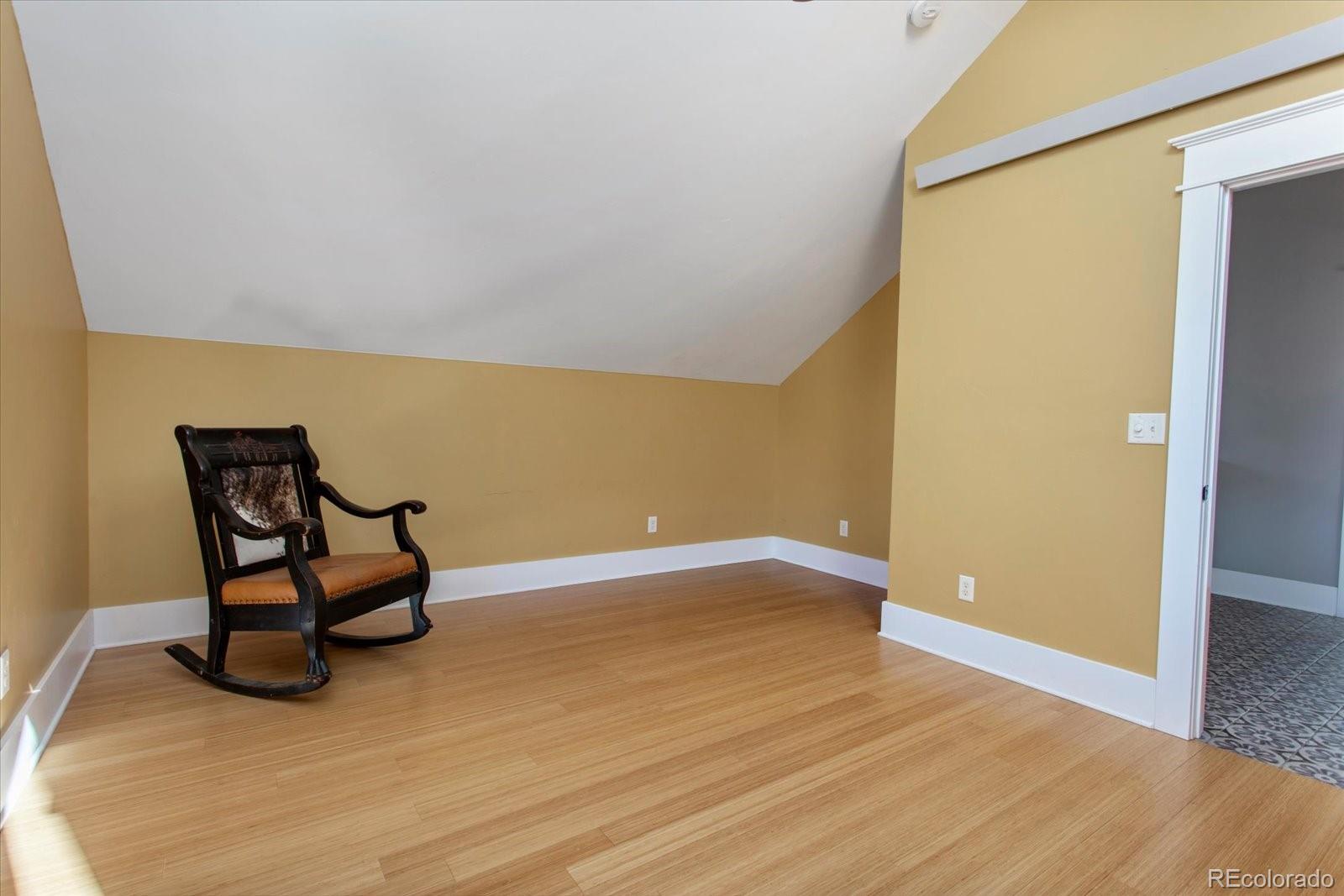 1208 E Street Salida, CO 81201 - Photo 30 of 50 a view of a room with wooden floor and furniture