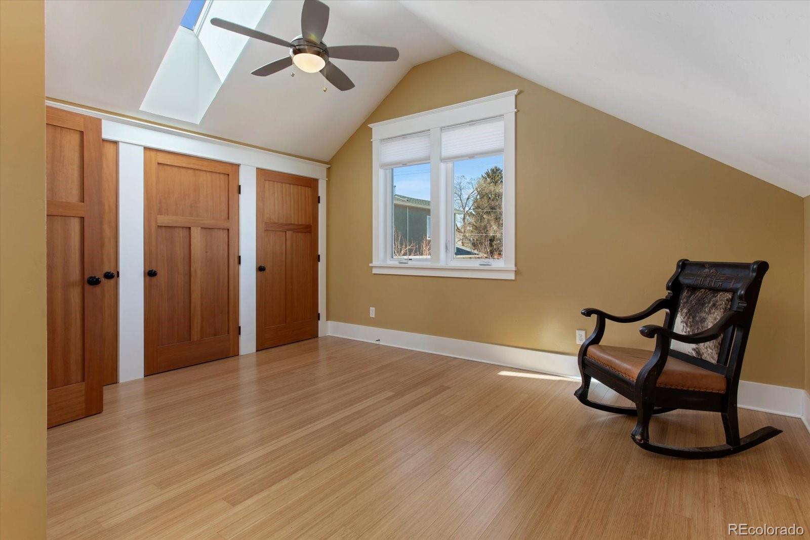 1208 E Street Salida, CO 81201 - Photo 31 of 50 an empty room with wooden floor and windows