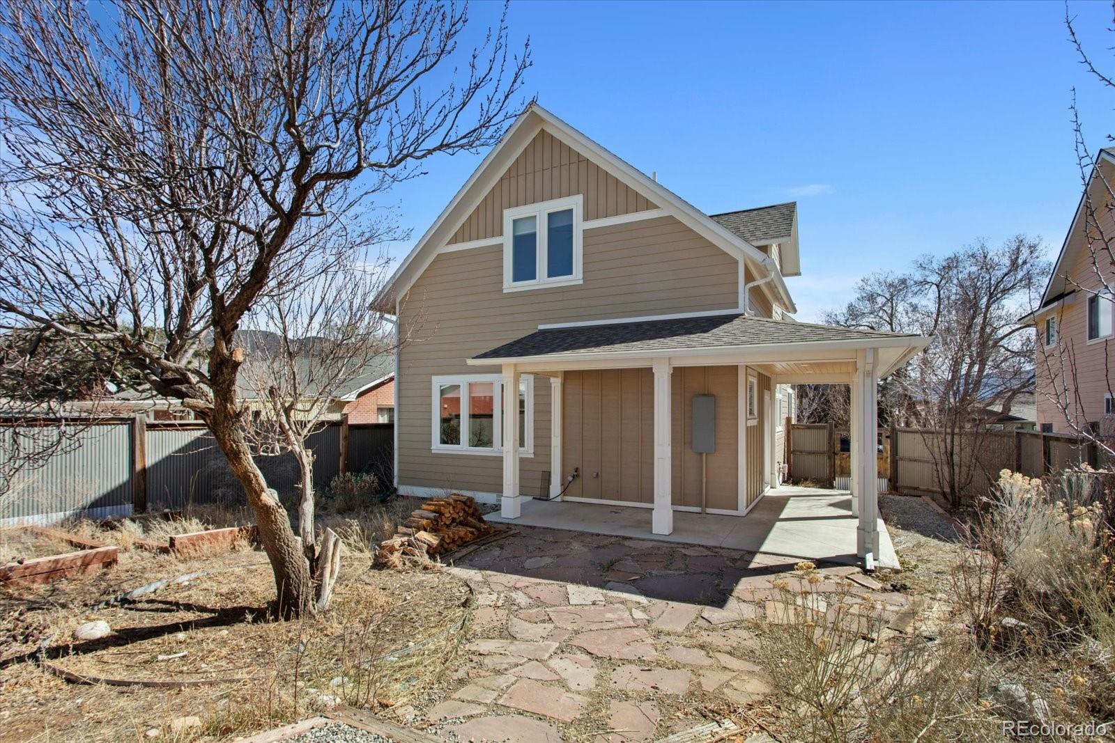 1208 E Street Salida, CO 81201 - Photo 37 of 50 a view of a brick house with yard and large tree