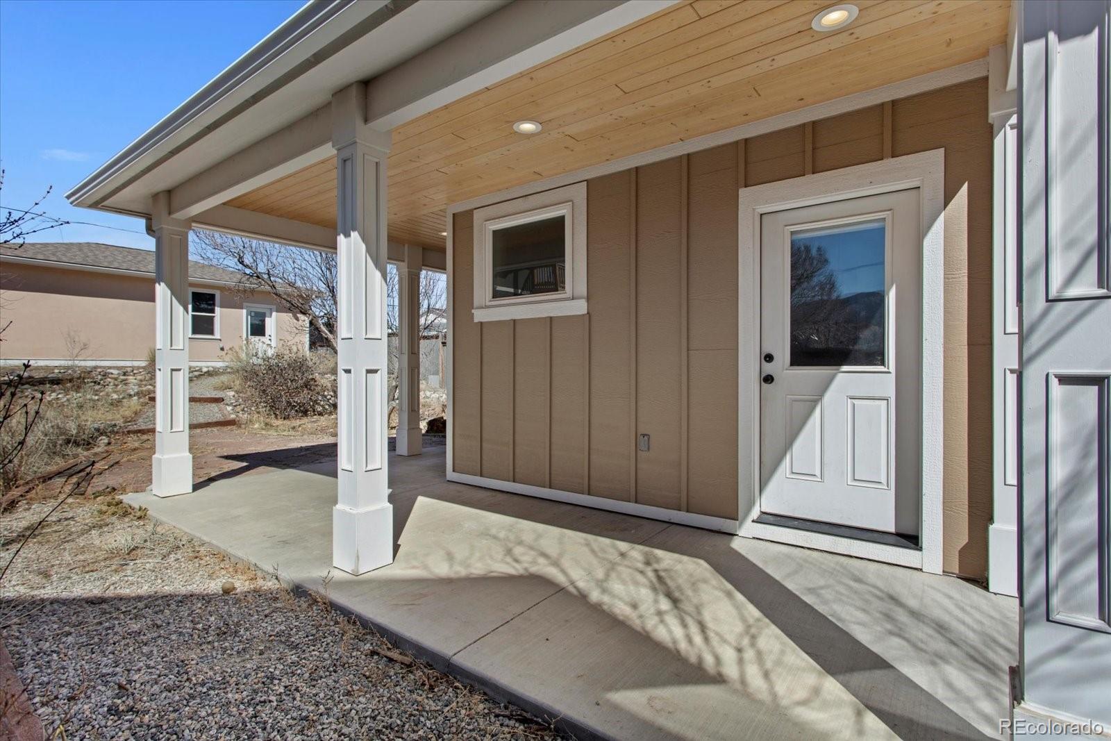 1208 E Street Salida, CO 81201 - Photo 38 of 50 a view of a hallway with wooden floor and fence