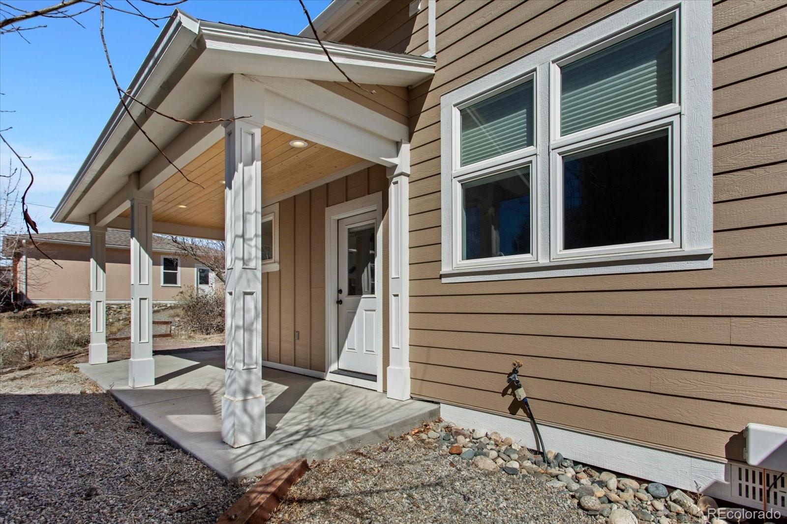 1208 E Street Salida, CO 81201 - Photo 39 of 50 a view of house with wooden door and wooden floor