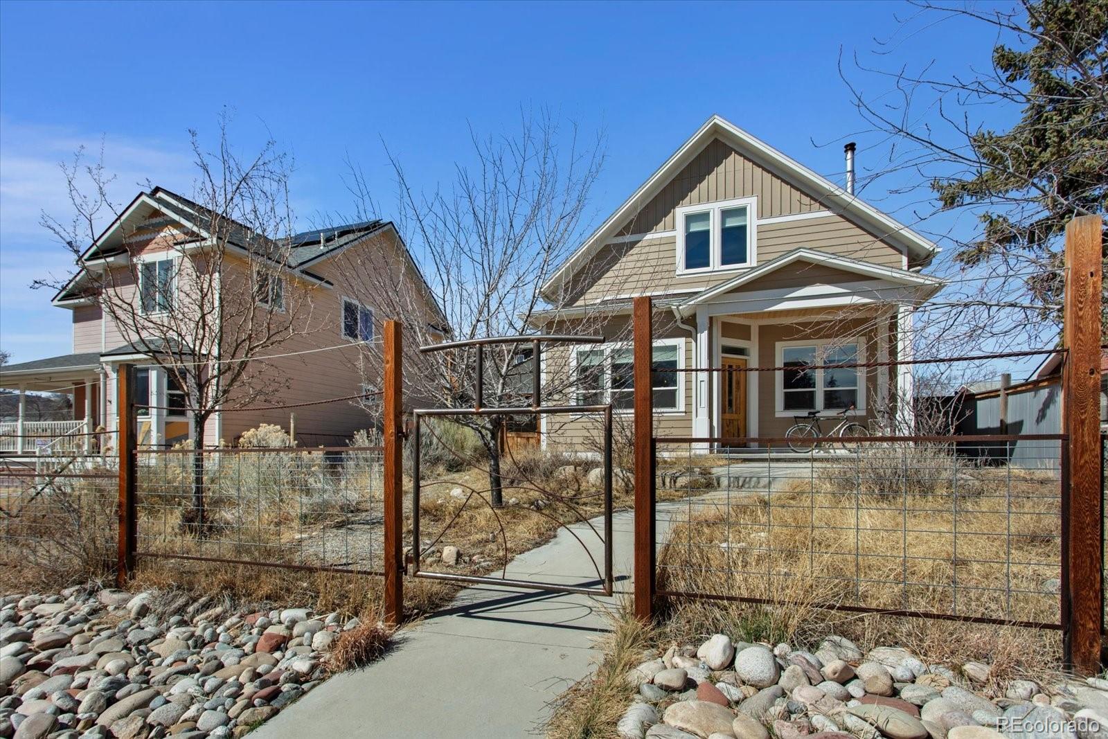 1208 E Street Salida, CO 81201 - Photo 4 of 50 a view of a brick house with large windows