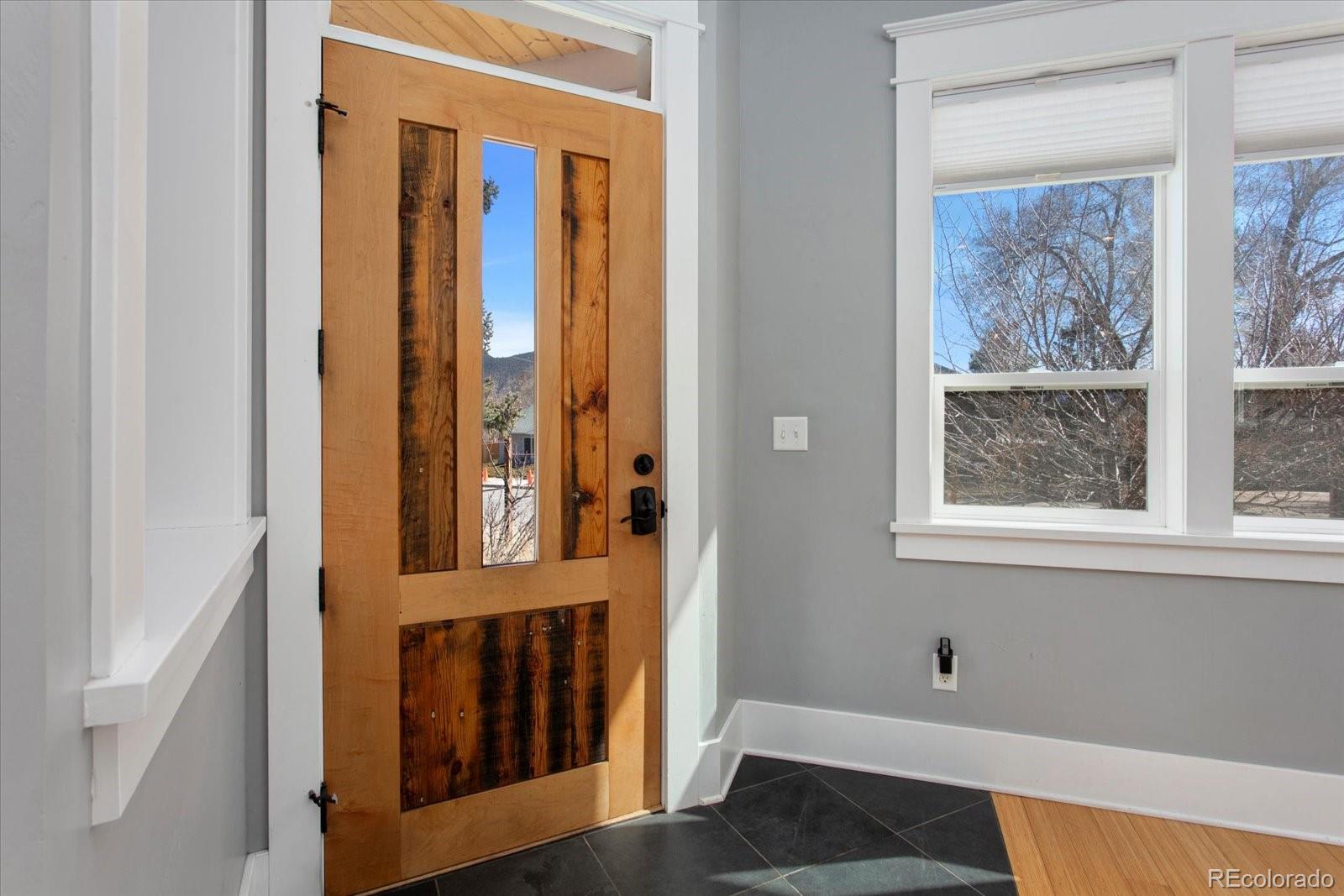 1208 E Street Salida, CO 81201 - Photo 5 of 50 a view of an entryway with wooden floor and door