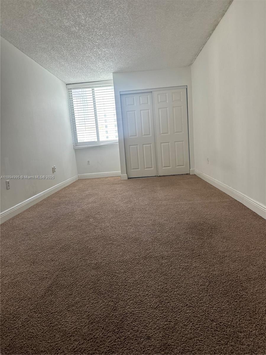 850 North Miami Avenue, Unit 810 Miami, FL 33136 - Photo 15 of 19 an empty room with windows