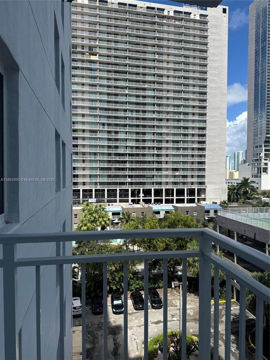 850 North Miami Avenue, Unit 810 Miami, FL 33136 - Photo 10 of 19 a backyard of a house with barbeque oven and outdoor seating