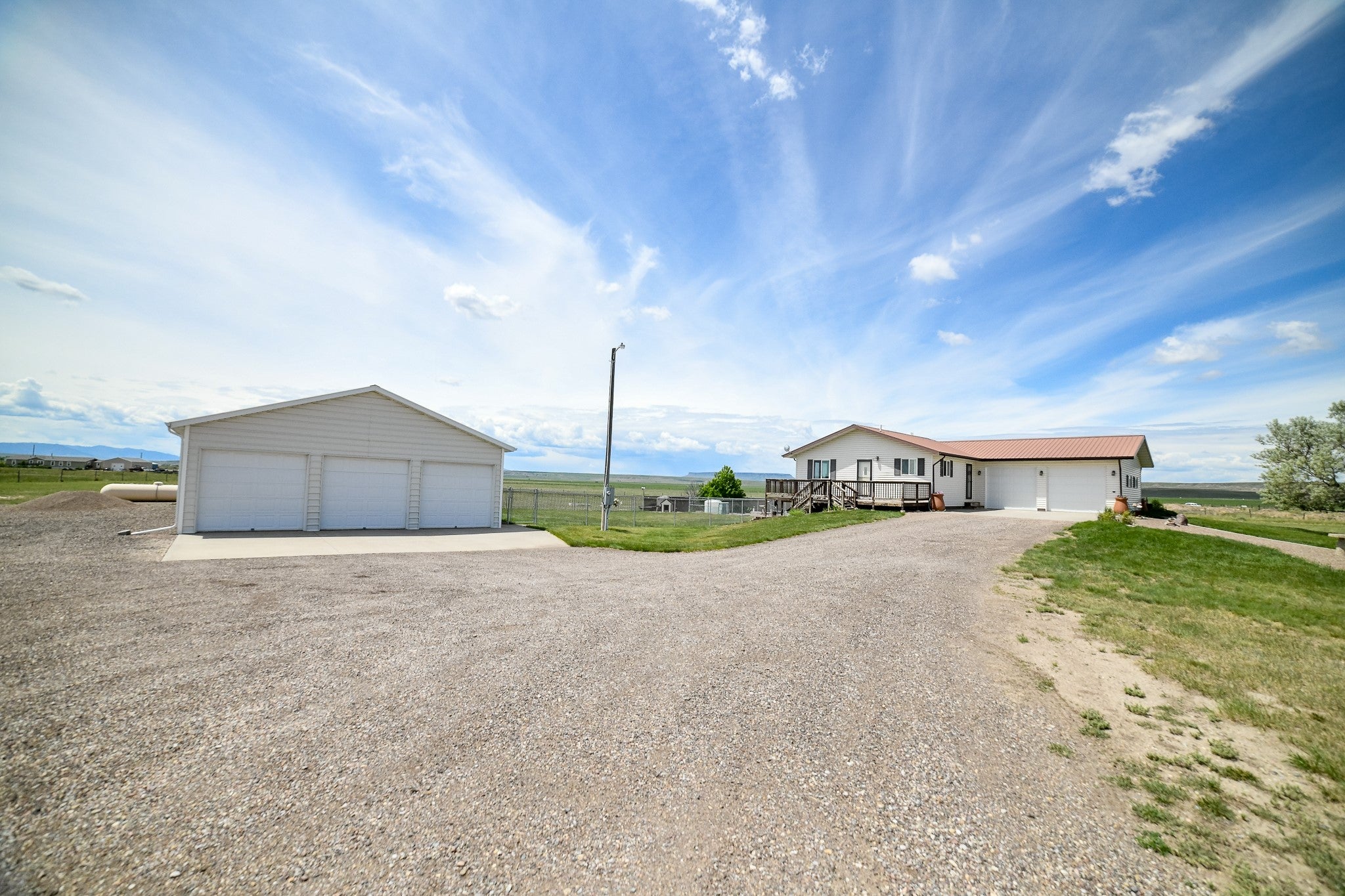 930 Luebbe Road Ulm, MT 59485 - Photo 1 of 1 View of front of house with a garage and an outbuilding
