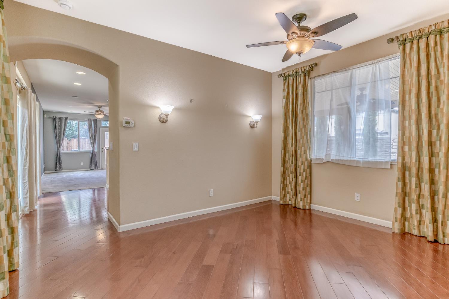 188 Thomsen Road Lathrop, CA 95330 - Photo 8 of 27 wooden floor in an empty room with a window