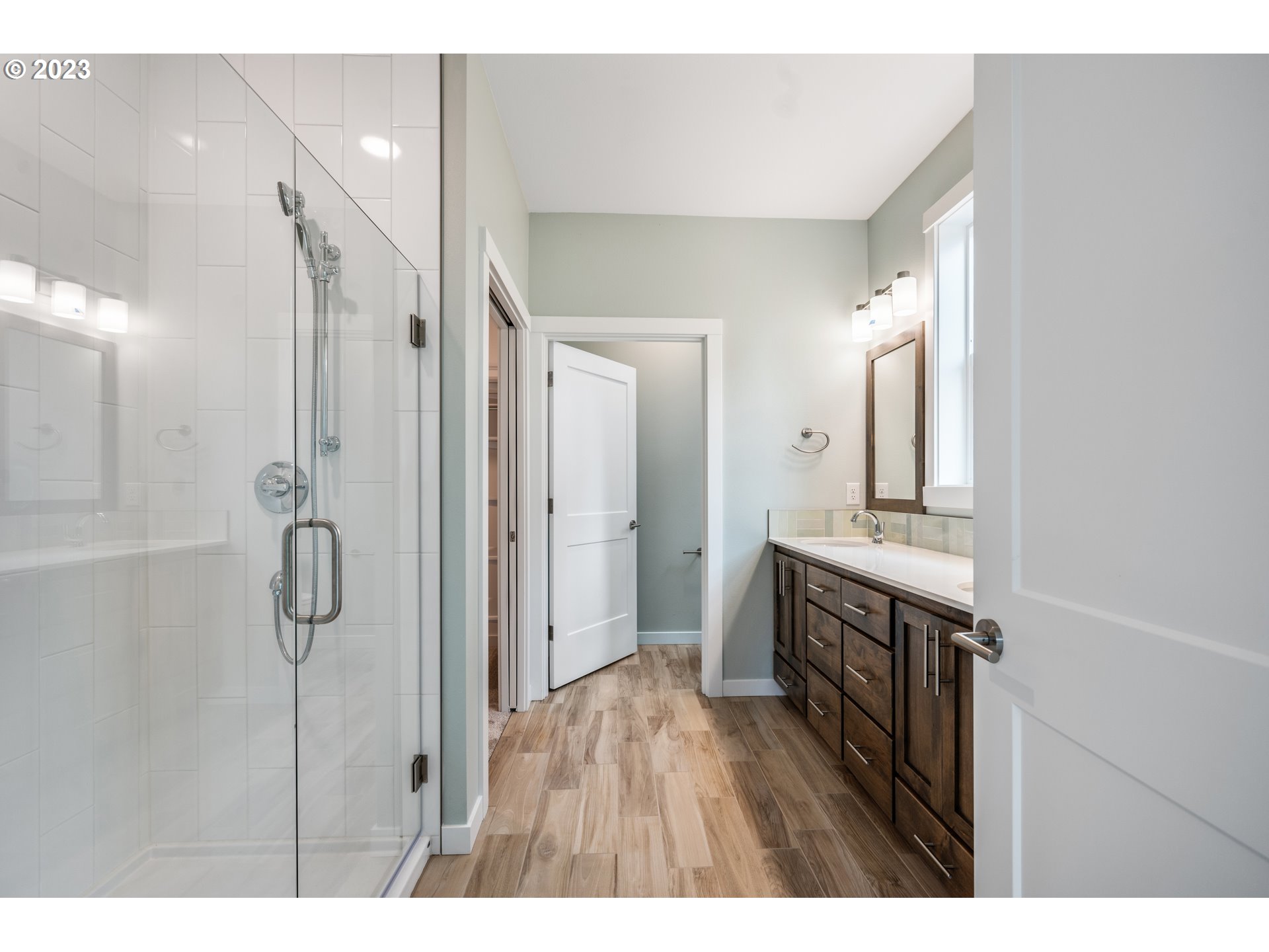 2034 South Royal Court Ridgefield, WA 98642 - Photo 34 of 48 a bathroom with a granite countertop sink shower and a mirror