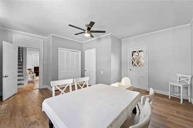 a bed room with a bed a table and chair