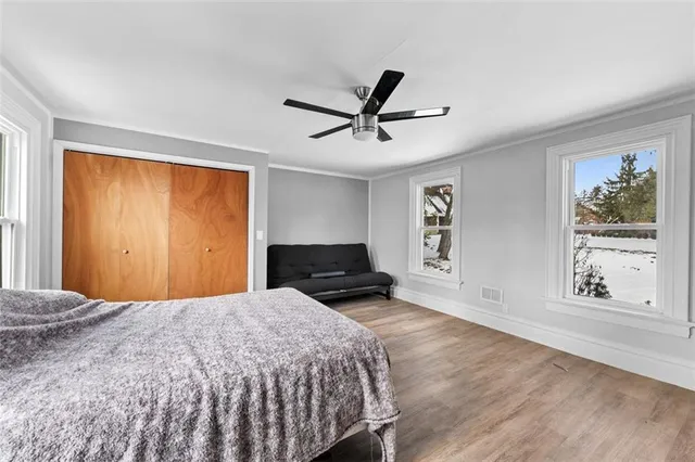 a bedroom with a large bed and a window