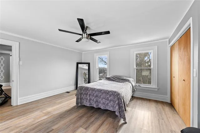 a bedroom with a bed and a window