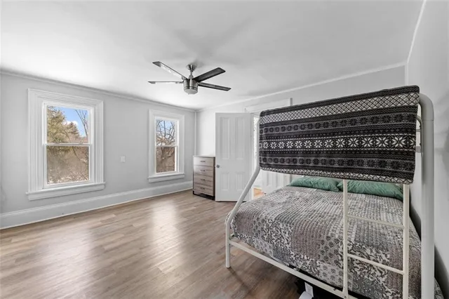 a view of room with window and wooden floor