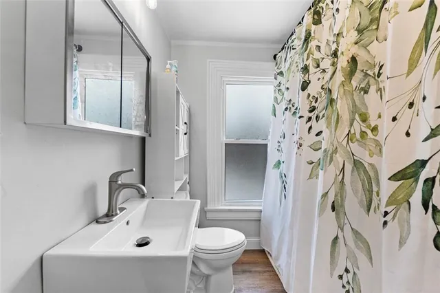 a bathroom with a sink and mirror