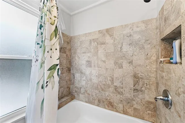 a bathroom with a shower curtain