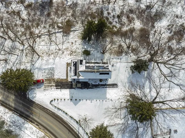 a view of a yard covered with snow