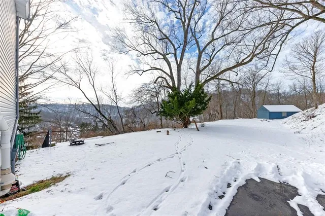 a view of a snow with snow on the road