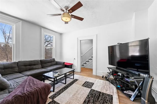 a living room with furniture and a flat screen tv