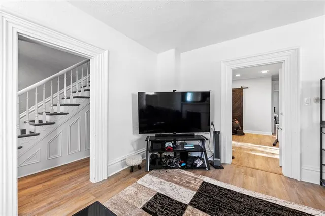 a room with furniture and a flat screen tv