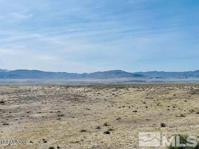 394006 Poker Brown Camp Road Lovelock, NV 89419 - Photo 5 of 11 a view of wooden floor and mountains in the background