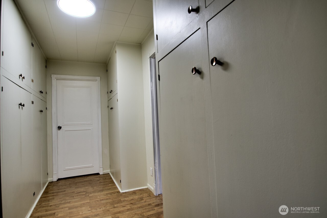 1296 Centralia Alpha Road Chehalis, WA 98532 - Photo 13 of 39 a view of a livingroom with wooden floor and a ceiling fan
