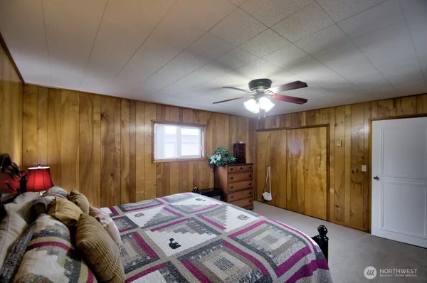 a bed room with a bed and a window
