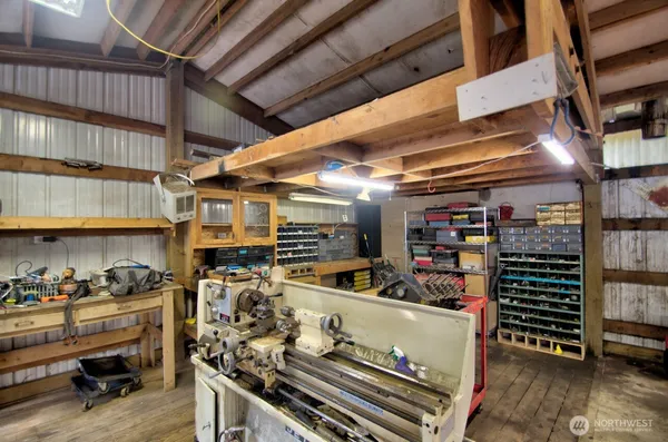 a view of a storage room with a fridge