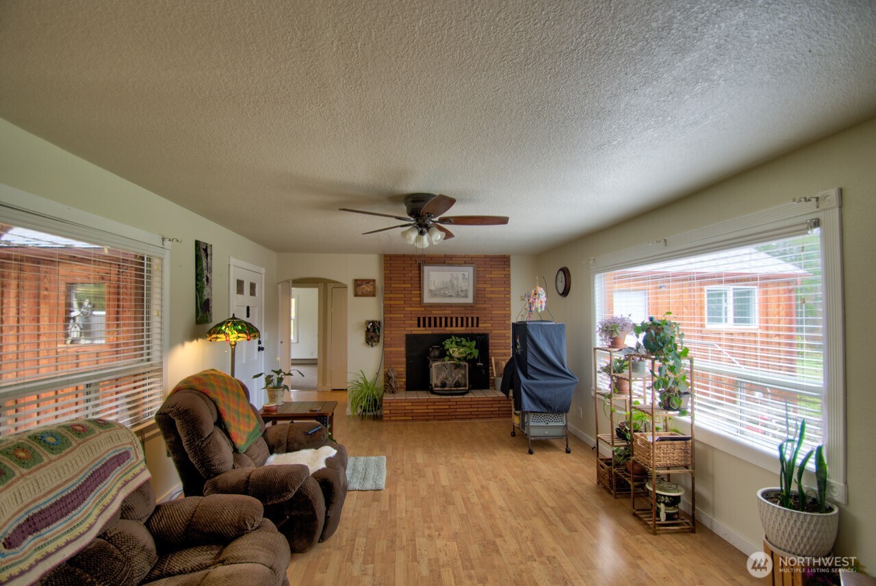 1296 Centralia Alpha Road Chehalis, WA 98532 - Photo 7 of 39 a living room with furniture and a fireplace