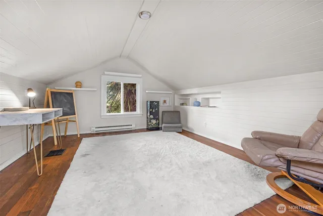 a spacious bedroom with a bed and a large window