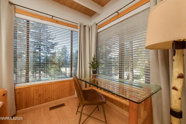 a bedroom with furniture and a rug
