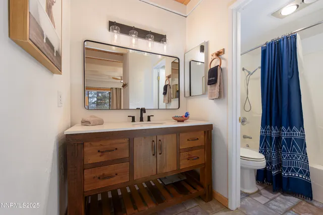 a bedroom with a bed and a table