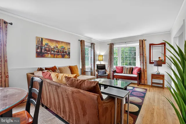 a living room with furniture and a rug