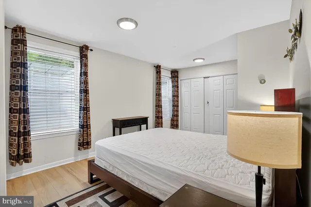 a bedroom with a bed and a table in it