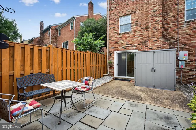 a patio with table and chairs