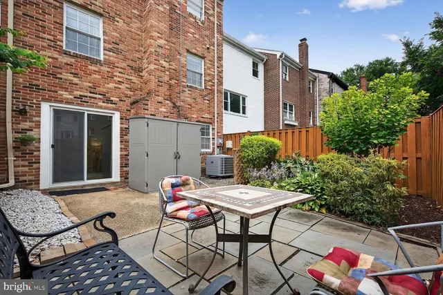 a view of backyard with outdoor seating