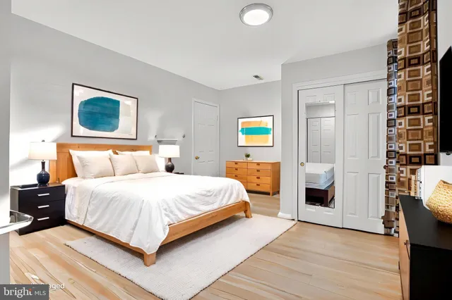 a bedroom with a bed and a couch