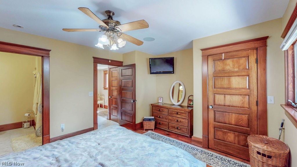 1431 Cedar Point Road Sandusky, OH 44870 - Photo 24 of 50 Bedroom with baseboards and a ceiling fan