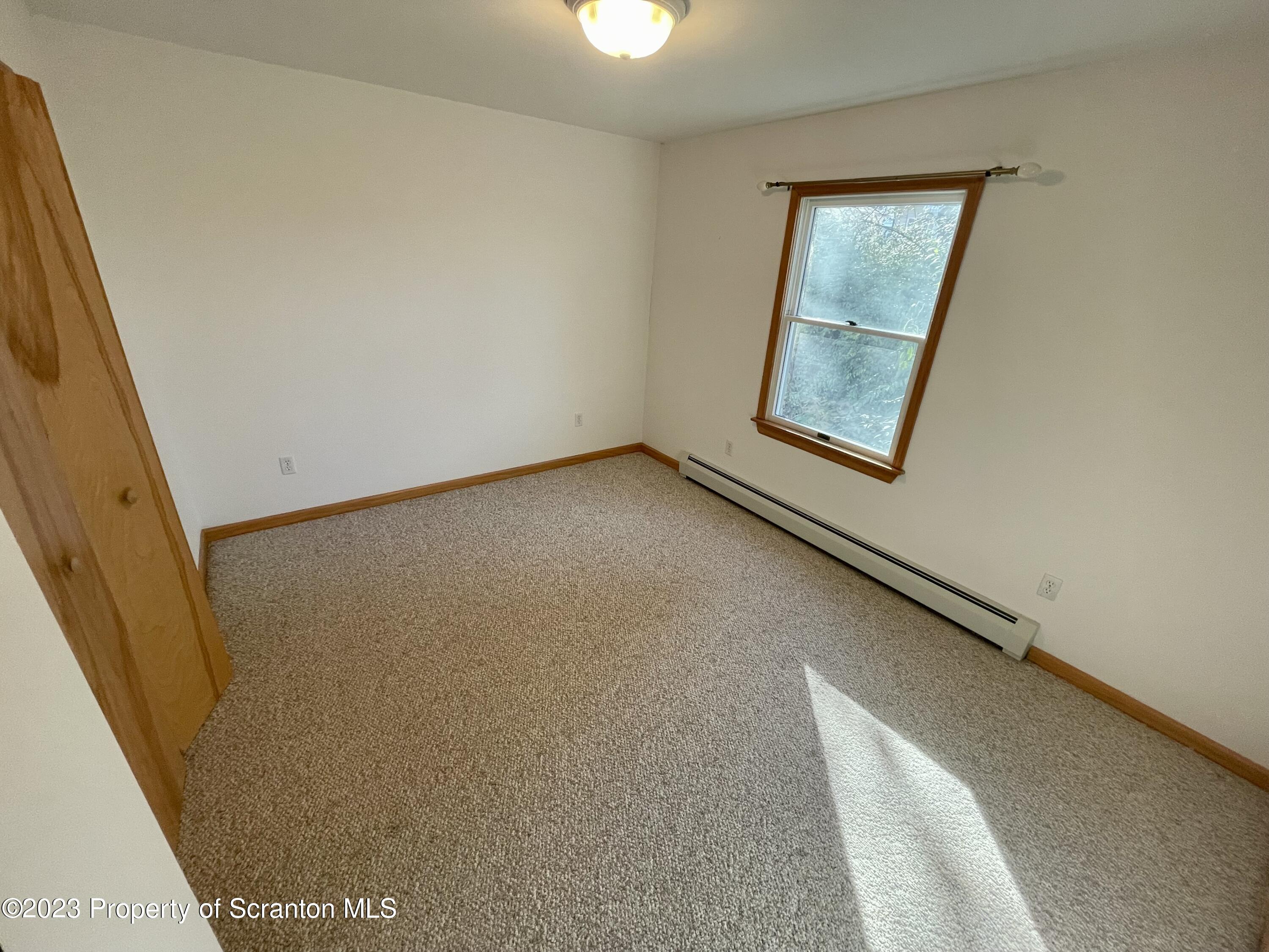 131 Smith Street, Unit A4 Dunmore, PA 18512 - Photo 11 of 12 a view of an empty room and window