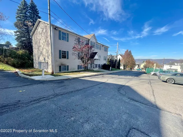 a view of the house with a swimming pool