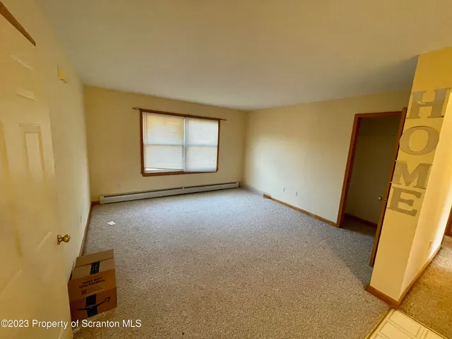 an empty room with a mirror