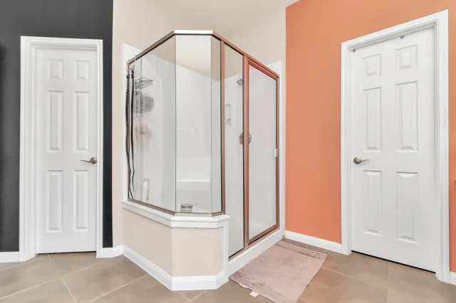 an empty room with mirror