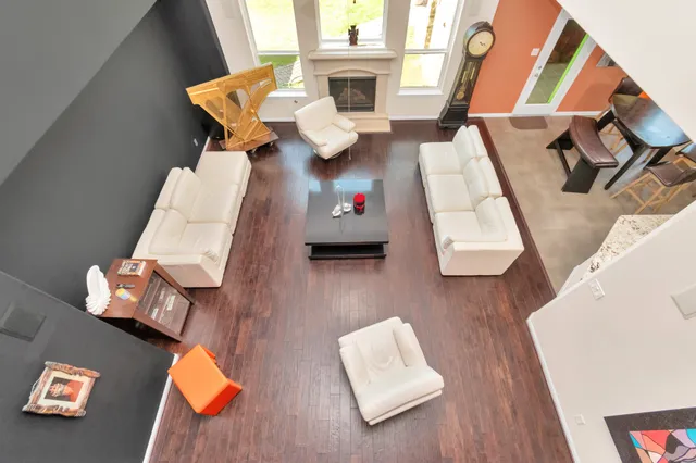 an aerial view of living room with furniture and a couch