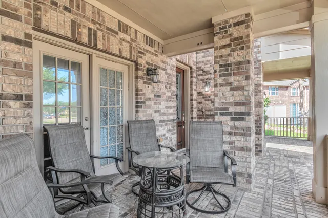 a front view of a house with chairs