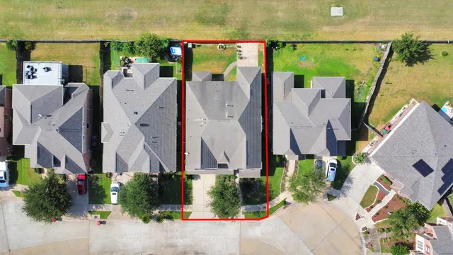 an aerial view of a house with a garden and balcony