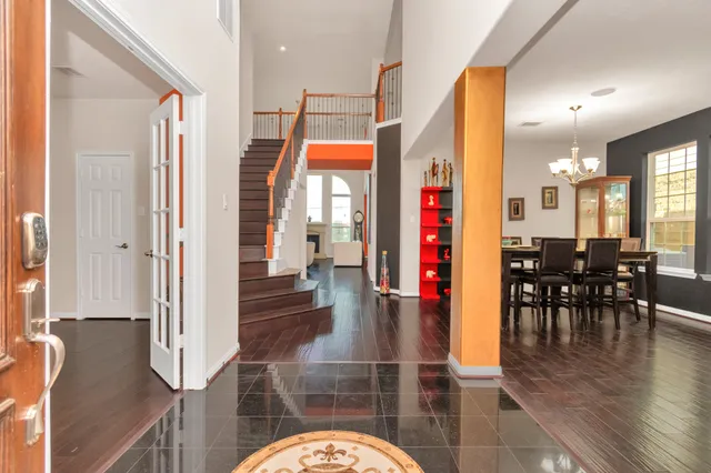 a lobby with furniture and floor to ceiling window