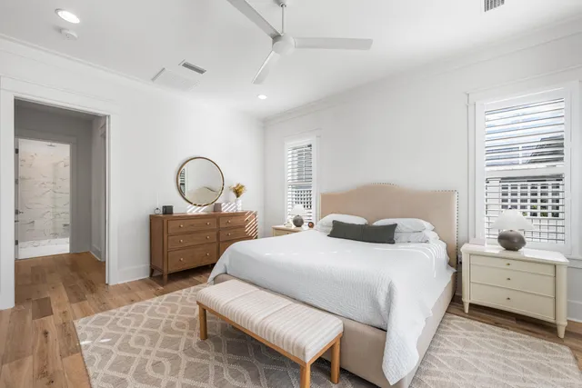 a bedroom with a bed and a couch