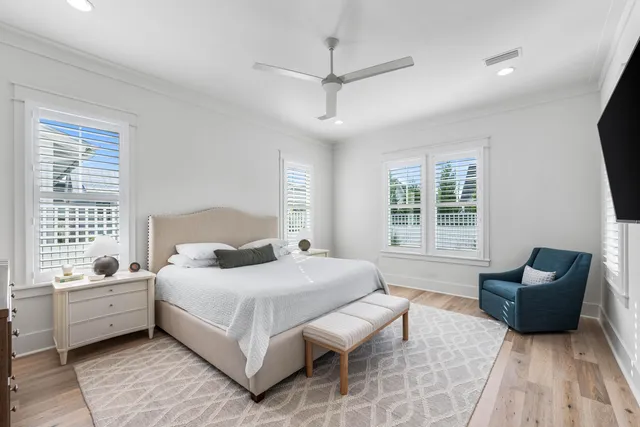 a bathroom with a large tub sink and double vanity