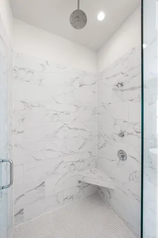 a view of a workspace with wooden floor and a window