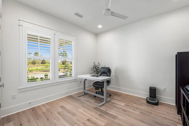 a bathroom with a granite countertop sink a toilet and shower
