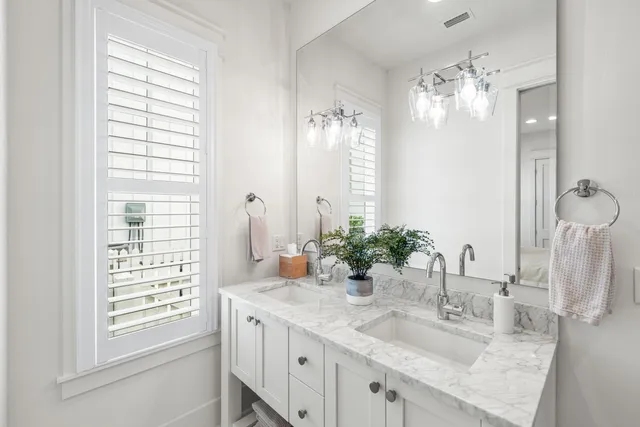 a utility room with sink dryer and washer